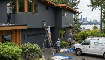 Professional house painter finishing exterior home in Seattle, WA